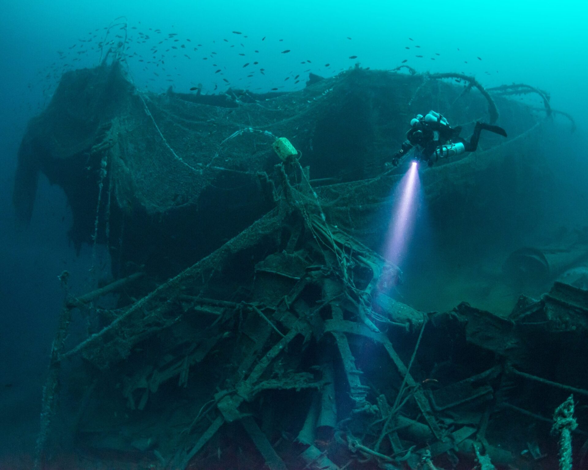 Diver exploring a shipwreck in Norway