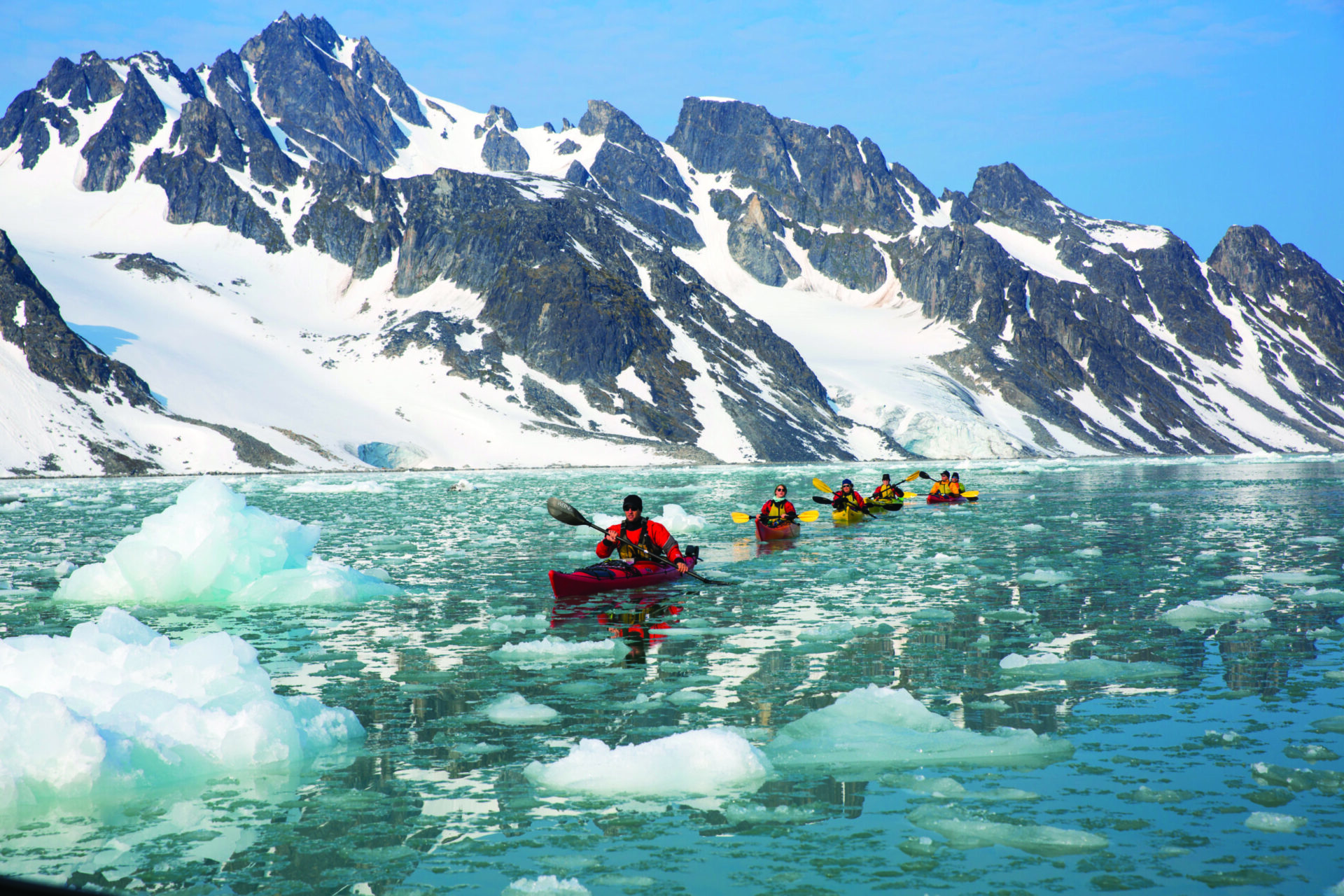 Passengers kayaking in Spitsbergen, Svalbard