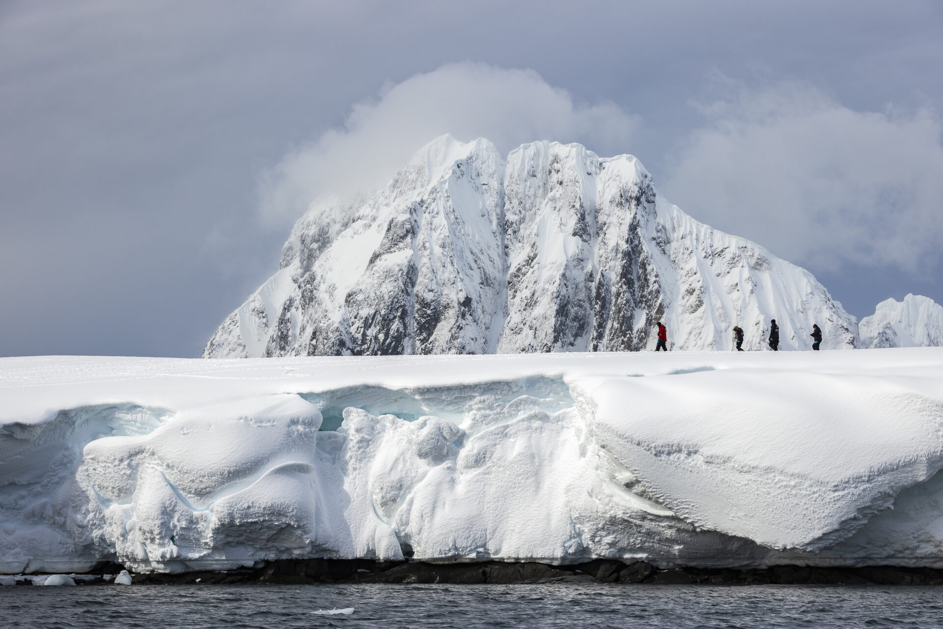 Expedition team and passengers on Booth Island, Antarctic Peninsula